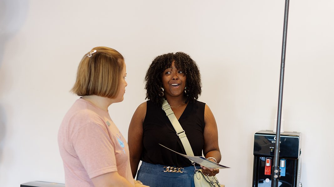 A Hydralive Huntersville team member in conversation with a client