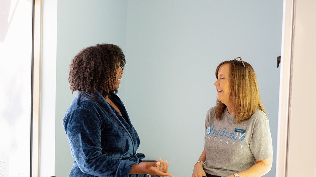A client and a Hydralive Huntersville team member talking one-on-one in a consult room