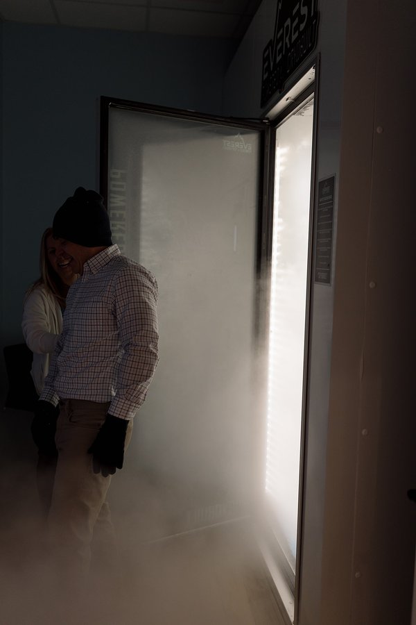 Cold fog rolling out of the cryotherapy chamber door